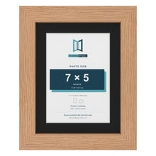Oak 9 x 7 inch picture frame with a black mount for a 7 x 5 inch photo