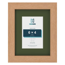 Oak 9 x 7 inch picture frame with a green mount for a 6 x 4 inch photo