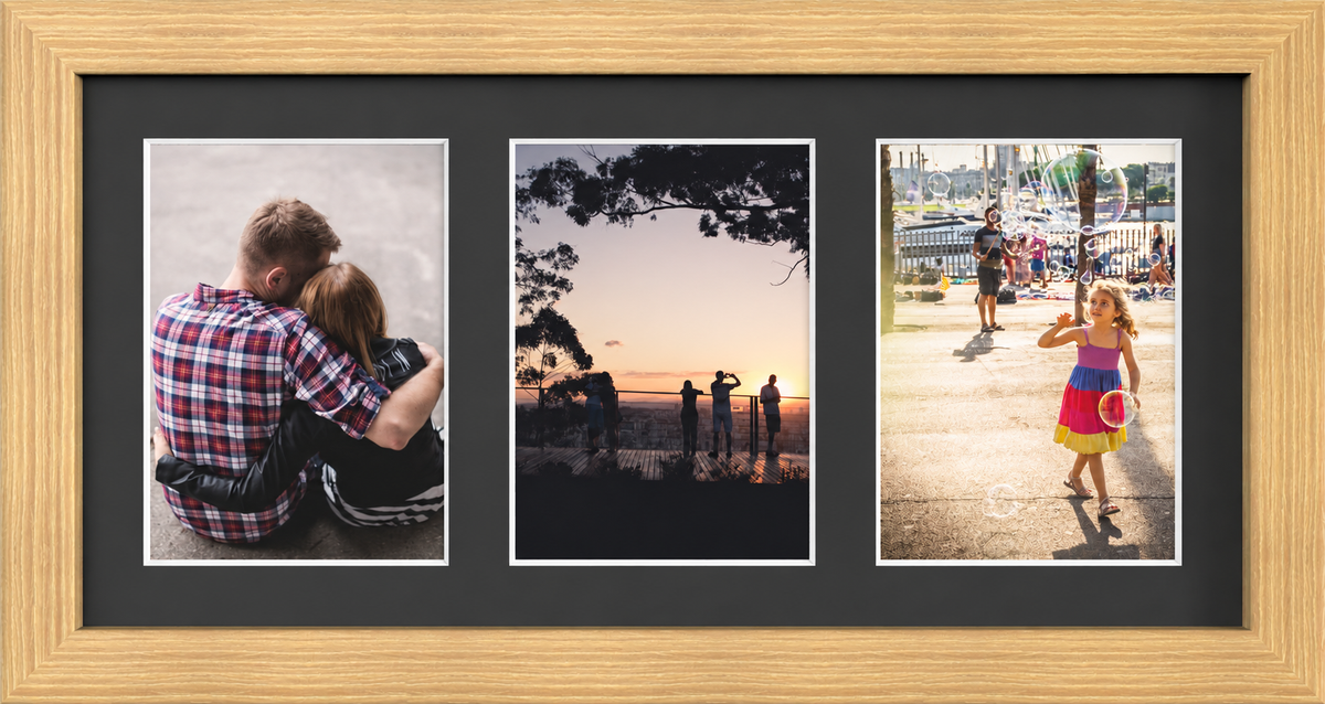 Pine Multi-Aperture Frame for 3 Photos 7x5" with Black Mount displaying photographs