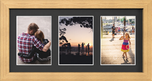 Pine Multi-Aperture Frame for 3 Photos 7x5" with Black Mount displaying photographs