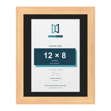 Pine 14 x 11 inch picture frame with a black mount for a 12 x 8 inch photo