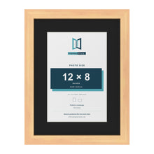 Pine 16 x 12 inch picture frame with a black mount for a 12 x 8 inch photo