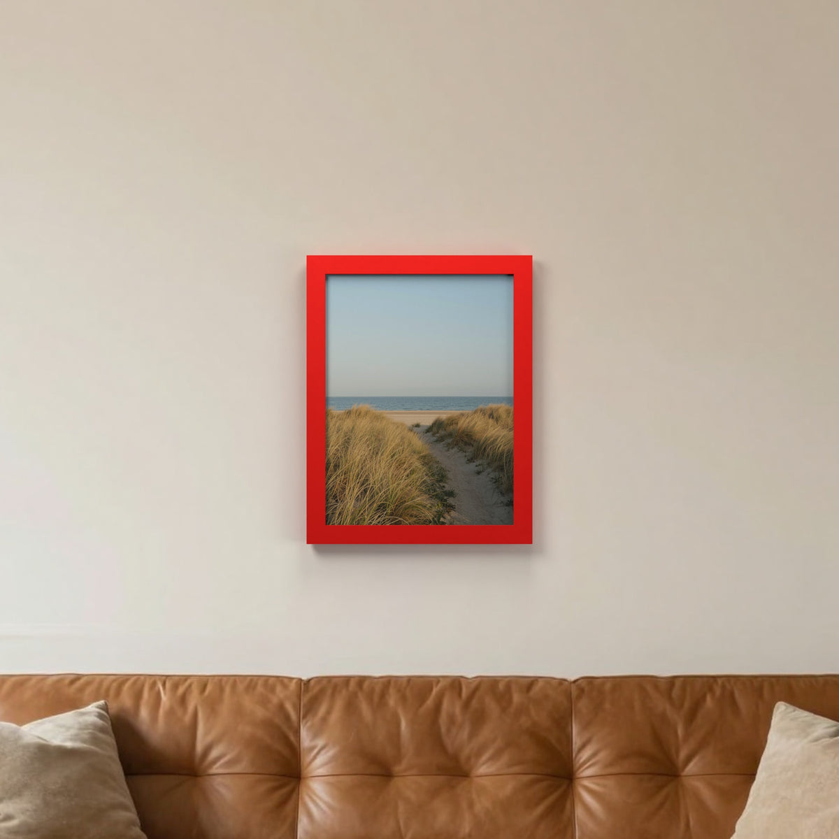 Red picture frame hanging on a living room wall