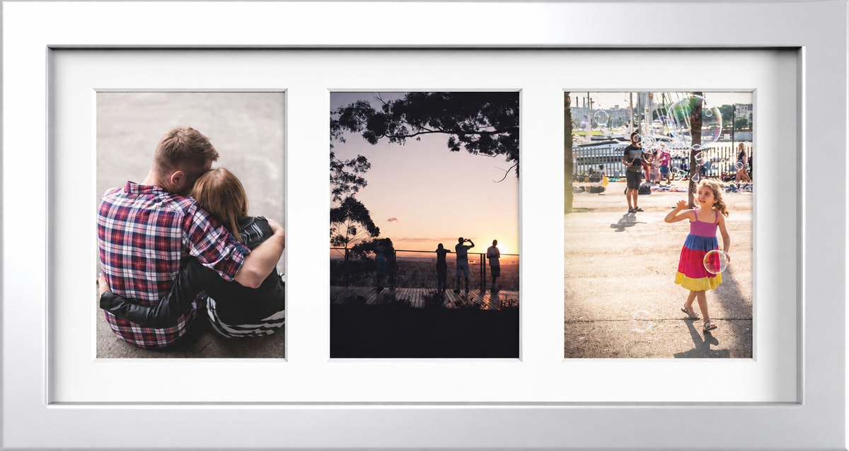 Silver multi-aperture frame with white mount displaying three 7x5 inch photographs