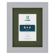 Silver 9 x 7 inch picture frame with a green mount for a 6 x 4 inch photo