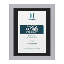 Silver picture frame with a black mount