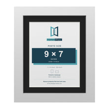 White 11 x 9 inch picture frame with a black mount for a 9 x 7 inch photo