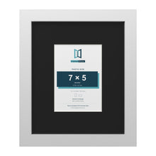 White 12 x 10 inch picture frame with a black mount for a 7 x 5 inch photo