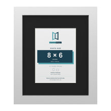 White 12 x 10 inch picture frame with a black mount for an 8 x 6 inch photo