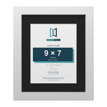 White 12 x 10 inch picture frame with a black mount for a 9 x 7 inch photo