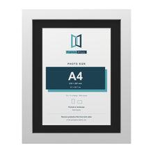 White 14 x 11 inch picture frame with a black mount for an A4 photo