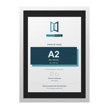 White 70 x 50 cm picture frame with a black mount for an A2 photo