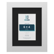 White 9 x 7 inch picture frame with a black mount for a 6 x 4 inch photo