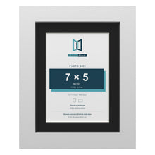 White 9 x 7 inch picture frame with a black mount for a 7 x 5 inch photo