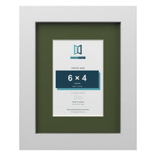White 9 x 7 inch picture frame with a green mount for a 6 x 4 inch photo