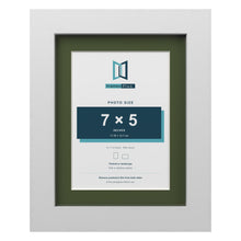 White 9 x 7 inch picture frame with a green mount for a 7 x 5 inch photo