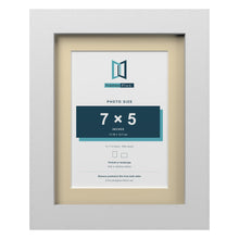 White 9 x 7 inch picture frame with an ivory mount for a 7 x 5 inch photo