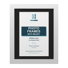 White picture frame with a black mount